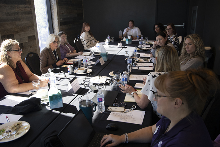 Women sitting around a table in a meeting