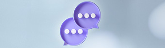 Two speech bubbles with ellipsis inside